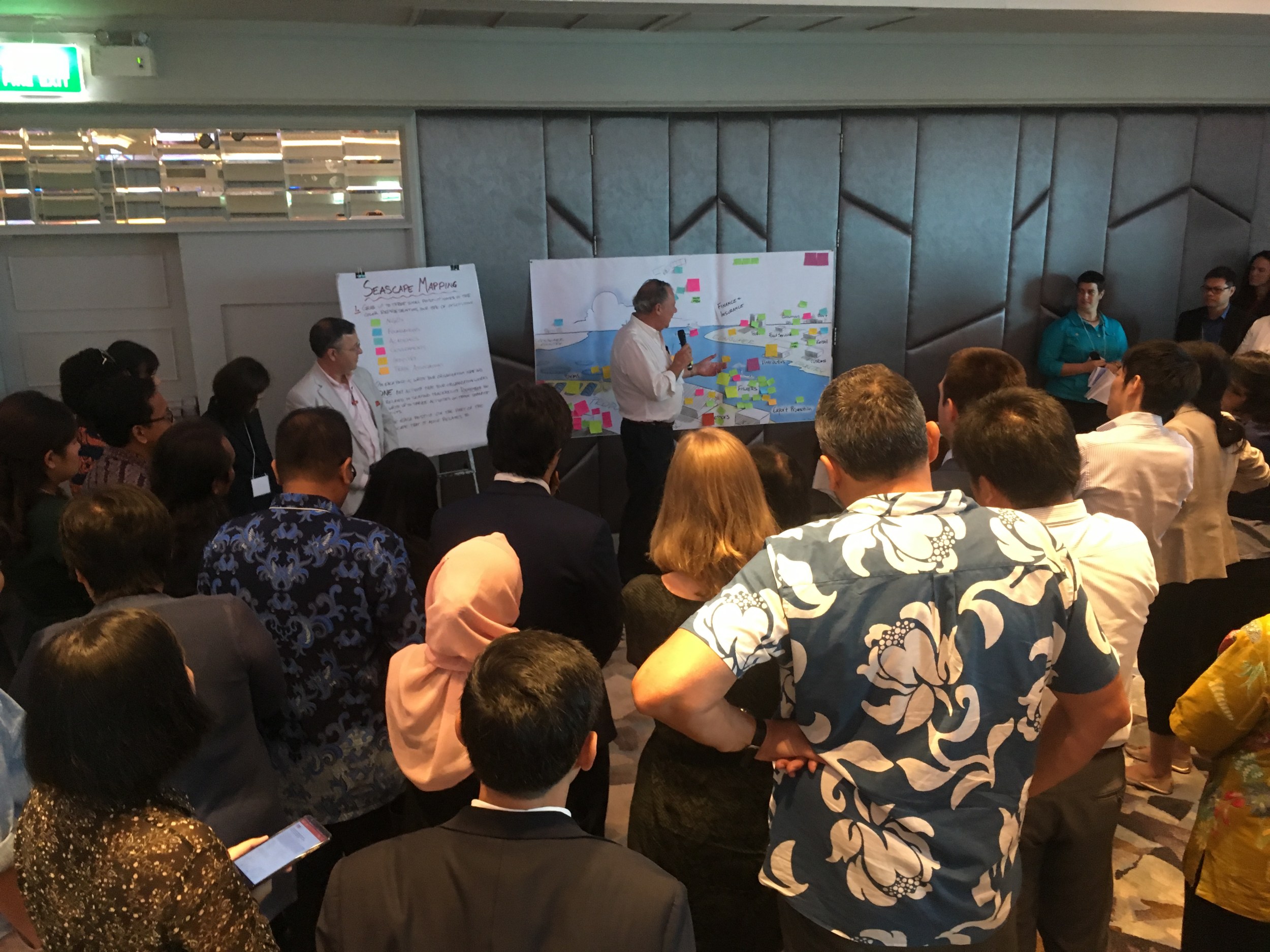 Participants at SALT's Datalab look at a drawing of the traceability seascape to discuss seascape mapping